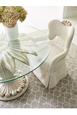 Glass top exposes leaf motif pedestal base beneath