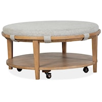 Transitional Round Cocktail Table with Upholstered Table Top