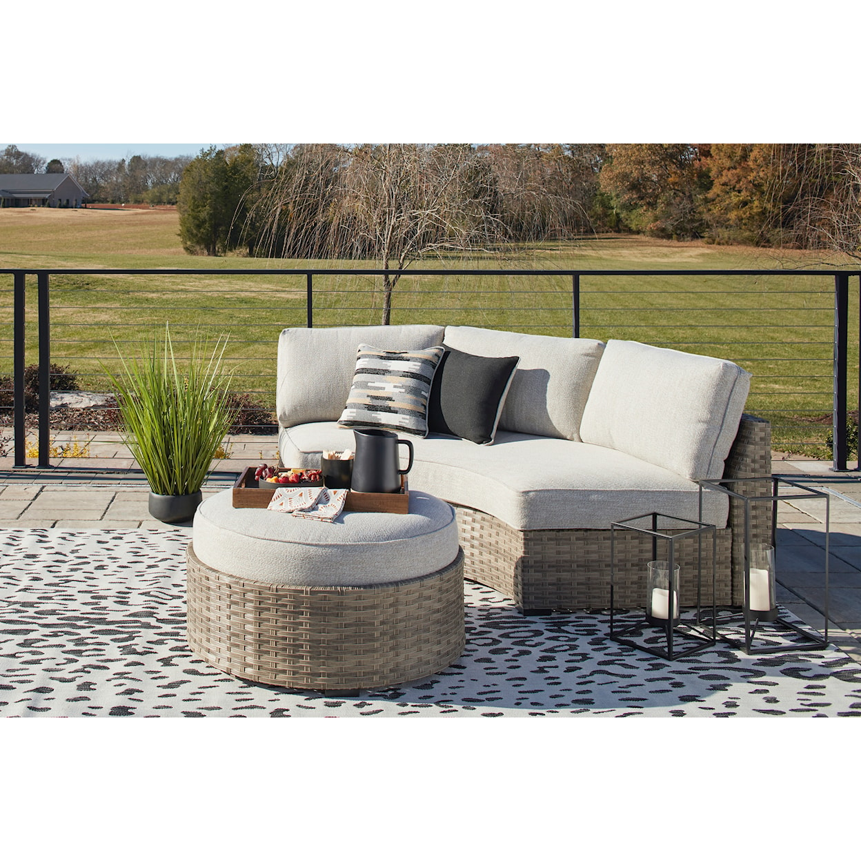 Signature Design Calworth Outdoor Curved Loveseat with Cushion