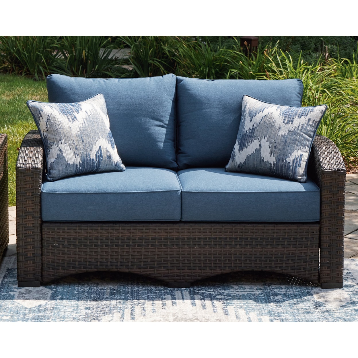 Signature Design Windglow Outdoor Loveseat with Cushion