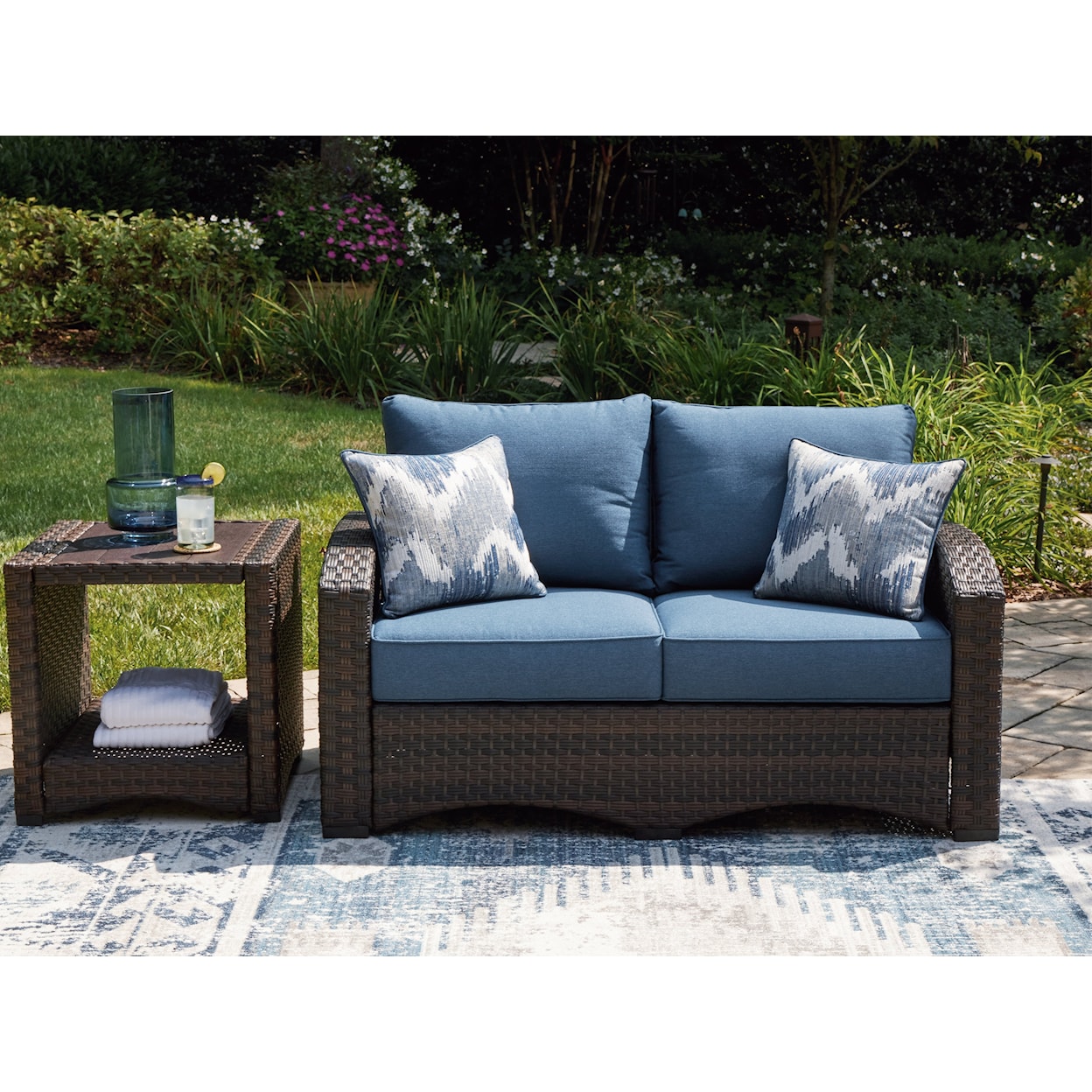 Ashley Furniture Signature Design Windglow Outdoor Loveseat with Cushion