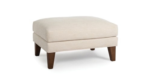Transitional Upholstered Ottoman with Exposed Wood Legs