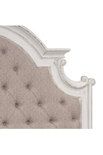 Button tufted headboard and dog bone corner accents