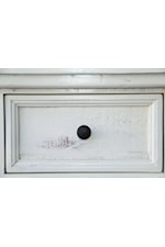 Decorative metal pulls on recessed drawer fronts