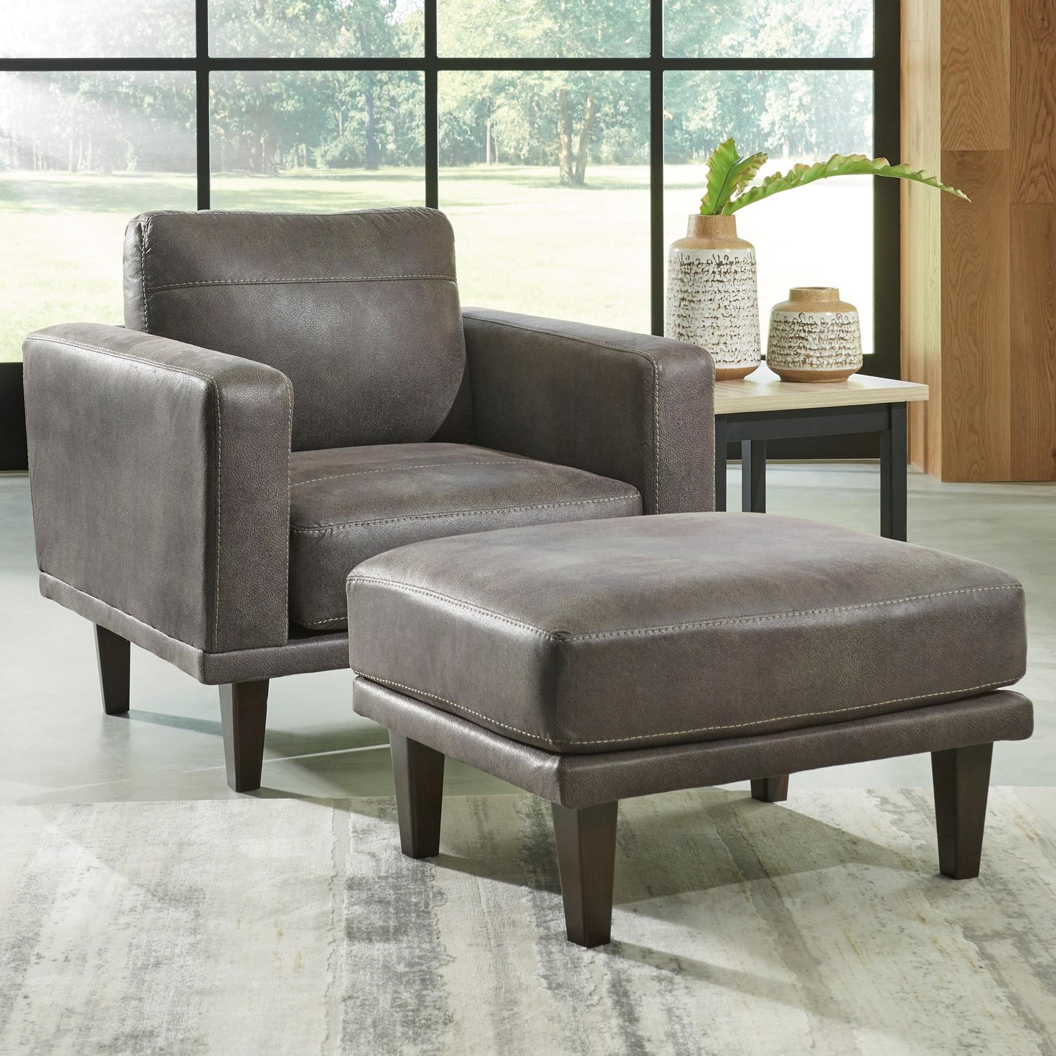 brown faux leather chair and ottoman