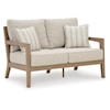 Ashley Furniture Signature Design Hallow Creek Outdoor Loveseat with Cushion