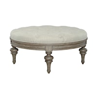 Transitional Round Cocktail Ottoman with Tufted Cushion