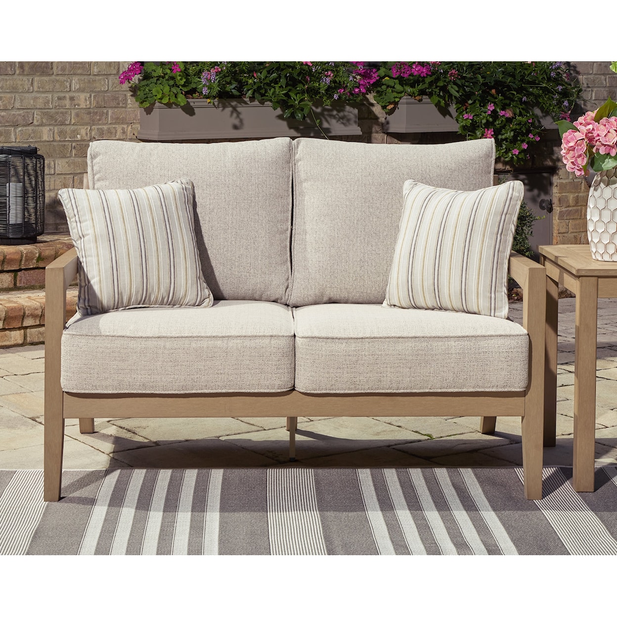 Signature Design by Ashley Hallow Creek Outdoor Loveseat with Cushion