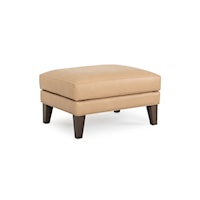 Transitional Upholstered Ottoman with Exposed Wood Legs