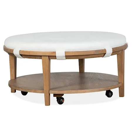 Transitional Round Cocktail Table with Upholstered Table Top