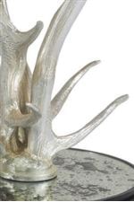 The silver leaf finish helps showcase the detail of the cast faux antlers.