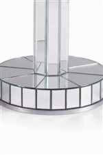 Detail of glass end table with reflecting mirror