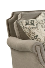 Scalloped Cushions and Nailhead Trim Add a Touch of Elegance to a Comfortable Piece