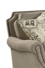 Scalloped Cushions and Nailhead Trim Add a Touch of Elegance to a Comfortable Piece