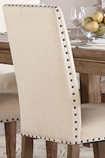 Nailhead Trim on Neutral Tone Upholstered Chair