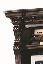 Ornately Carved Columns and Crown Moulded Case Tops