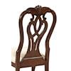 18th Century Influence Can Be Seen in the Classically Carved Splat Back Chairs