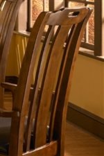 The Collection Has Two Sets of Dining Chairs that Both Feature Slat Backs