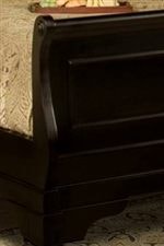 The Bed Has an Elegantly Curved Sleigh Footboard
