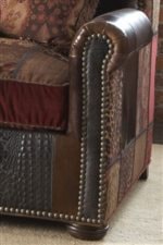 Traditional Rolled Arms and Wooden Bun Feet Show Classic Furniture Style with the Decorative, Studded Detail of Nail Head Borders