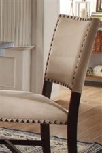 Nailhead Trim Along Upholstered Dining Chairs