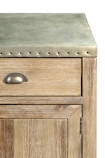 Metal-Wrapped Tops with Nailhead Studs and a Galvanized Finish Create an Eclectic Industrial Look
