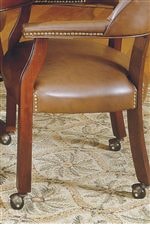 Brass Nail Head Trim and Casters on Arm Chair. 
