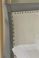 Upholstered Sleigh Headboard with Nailhead Trim