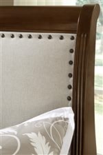 Upholstered Sleigh Headboard with Nailhead Trim