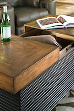 Sliding Table Top Storage Featured on Cocktail Table. 