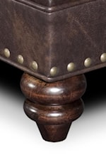 Base Adorned with Larger Nailheads and Turned Wood Feet