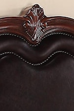 Upholstered Headboard with Nailhead Trim and Wood Carvings