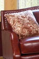 Stylish Track Arms and an Upholstered Seat Back lined with Pewter Finished Nail Heads