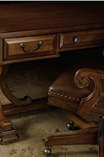 Raised Border Drawer Fronts and Graceful Scroll Arms