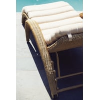 Curved Wicker Arms, Casters, and Pillow-Like Cushion on Chaise Lounge