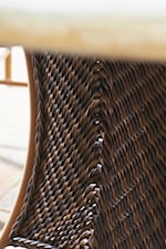 Detail of All-Weather Synthetic Wicker Featuring Intricate Woven Patterns and Designs in a Warm Umber Finish