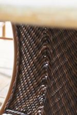 Detail of All-Weather Synthetic Wicker Featuring Intricate Woven Patterns and Designs in a Warm Umber Finish