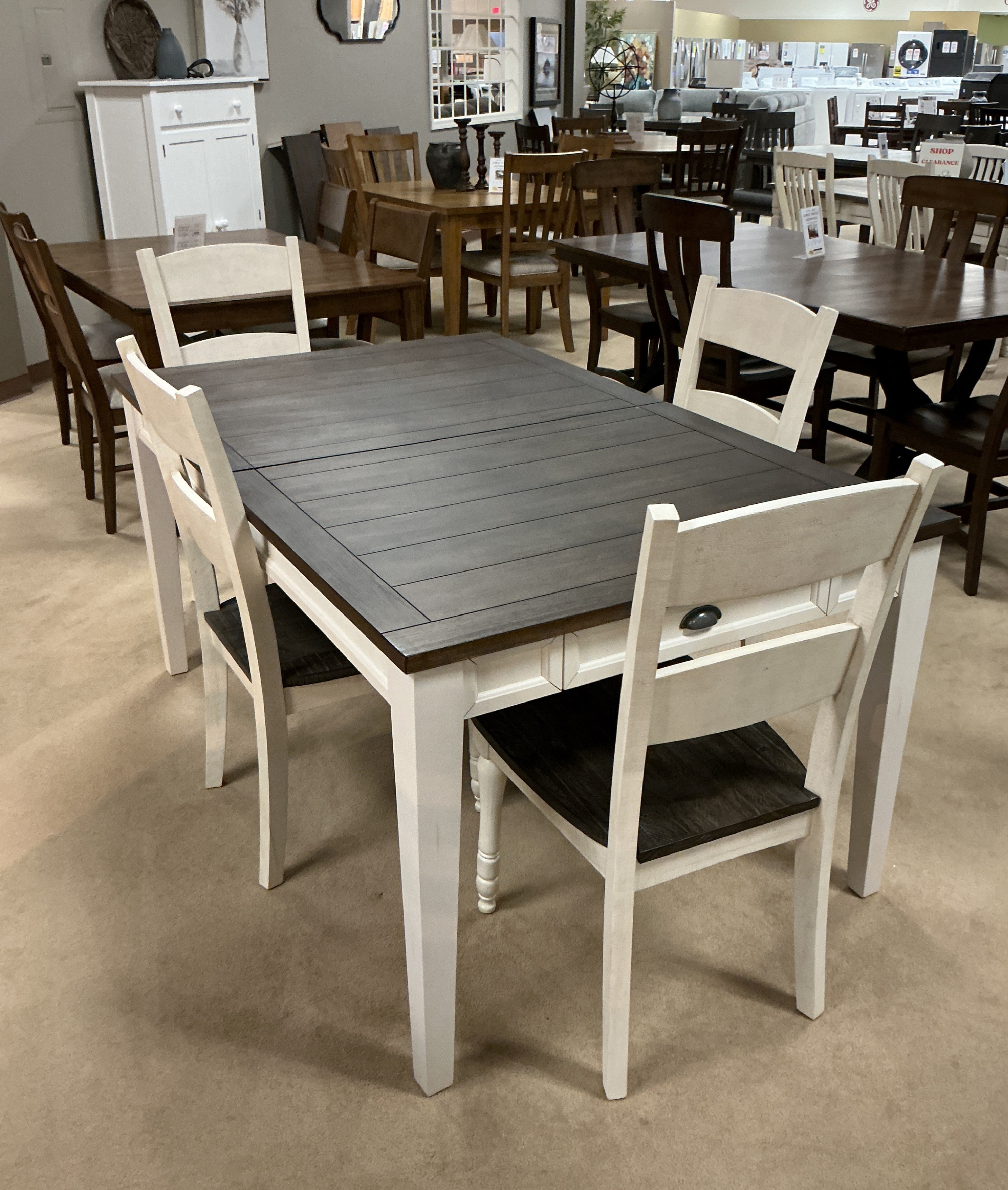 5 Piece Dining Set. Includes 64-80" table w/16? leaf table and 4 chairs. Table has 2 working drawers.