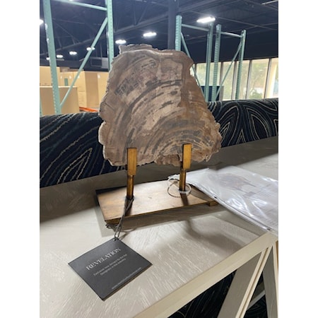 UTTERMOST CO.
PETRIFIED WOOD SCULPTURE
10W 11H 5D
Polished slice of petrified wood displayed on a heavily antiqued bronze stand. Due to the authentic nature of the wood, each will vary in color and size.