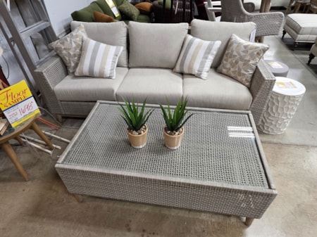This casual contemporary outdoor sofa and cocktail table would brighten up your outdoor space! Resin wicker made to outlast the elements and Nuvella high-performance fabrics bring chic to your patio.