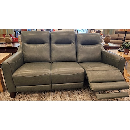 Power Leather reclining sofa with power headrests. Detailed stitching pattern with accented wood legs. Extra extension on the footrest that comes out when reclined.  80"W x 39"D x 42"H