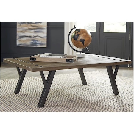 The Haffenburg coffee table is a riveting example of urban casual design. The plank effect mango wood top is finished in a clear nutmeg color for a naturally beautiful effect. Striking cantilevered metal legs and rivet head accents tie the look together for a well-edited aesthetic.

Made of mango wood

Clear nutmeg brown finish

Anodized bronze-tone metal legs with cantilevered accents

Plank style top with rivet accents

Assembly required