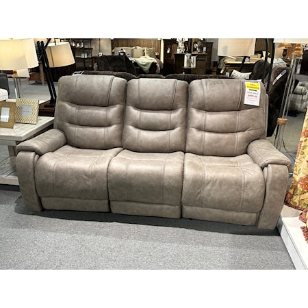Ashley reclining sofa with power recline and power headrest.  This 87" sofa is covered in a great tan faux leather and is ready for whatever you plan to binge watch next.  