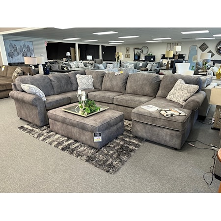 England 2400 Malibu sectional AND matching storage ottoman.  This sectional measures 135" across the back, 93" on the left side and 63" along the right side chaise lounge.  The matching ottoman is 47" wide x 29" deep.  Made in the USA by England Furniture and covered in a wonderfully plush gray polyester fabric.  