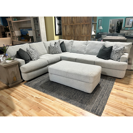 2 Piece sectional with ottman. Features detached back cushions and 6 down feather pillows included. 