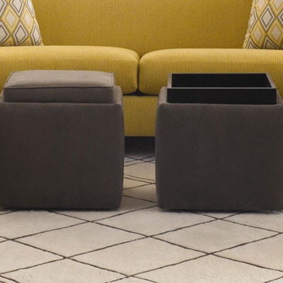 Two ottomans with top open for extra storage.