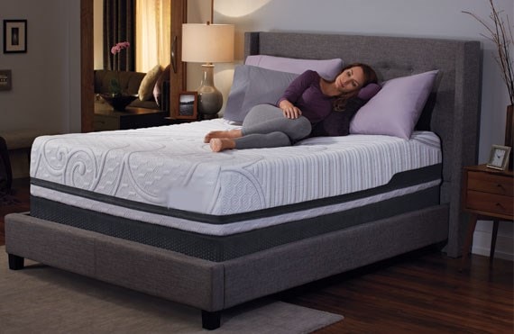 women laying on mattress