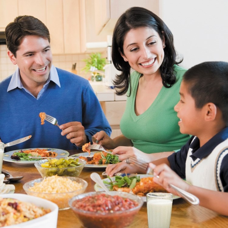 Family eating dinner at the table.