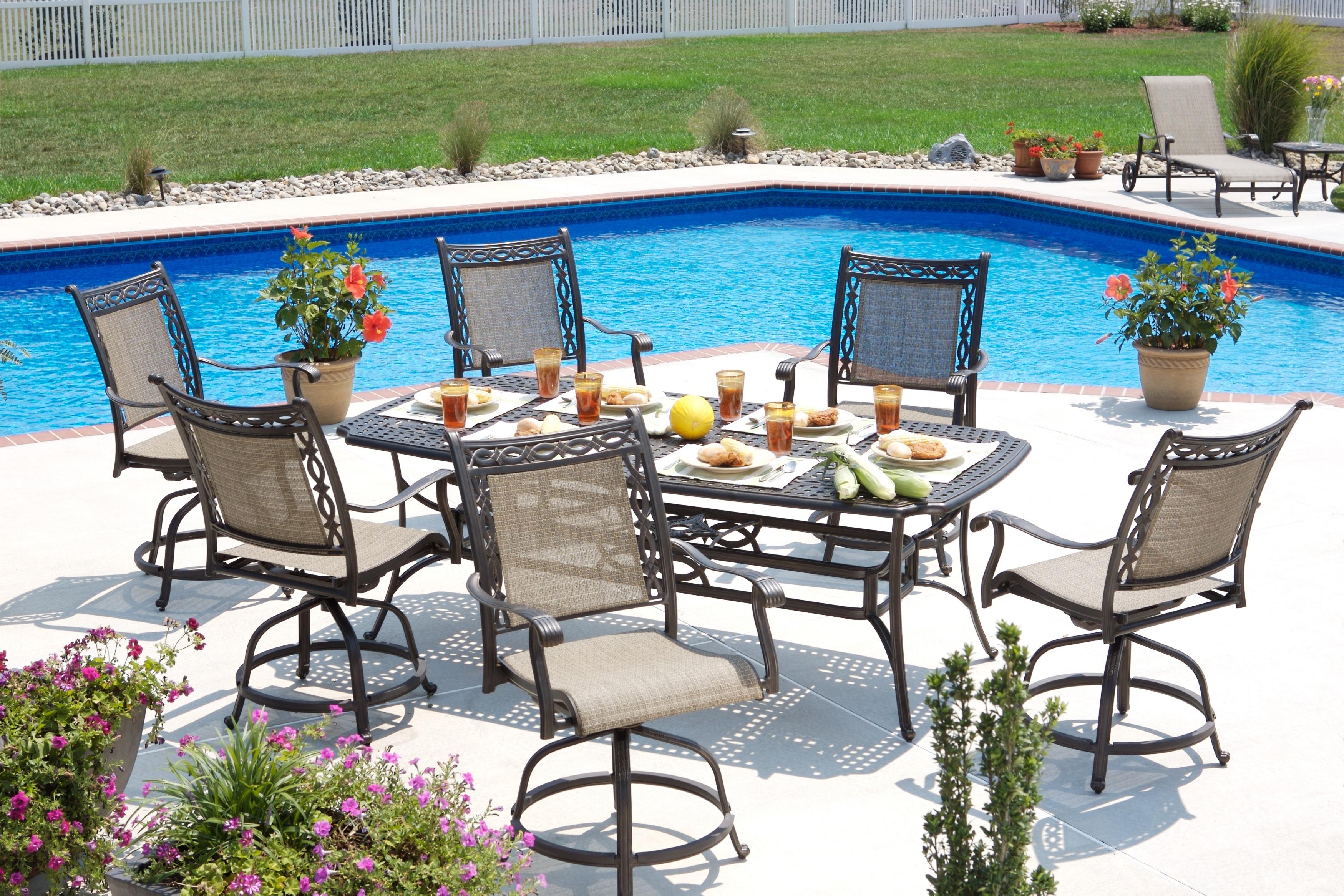 Apricity Outdoor Ashmost 7 Piece Sling Swivel Chair And Rectangular Cast Aluminum Table Dining Set Find Your Furniture Outdoor Dining Set