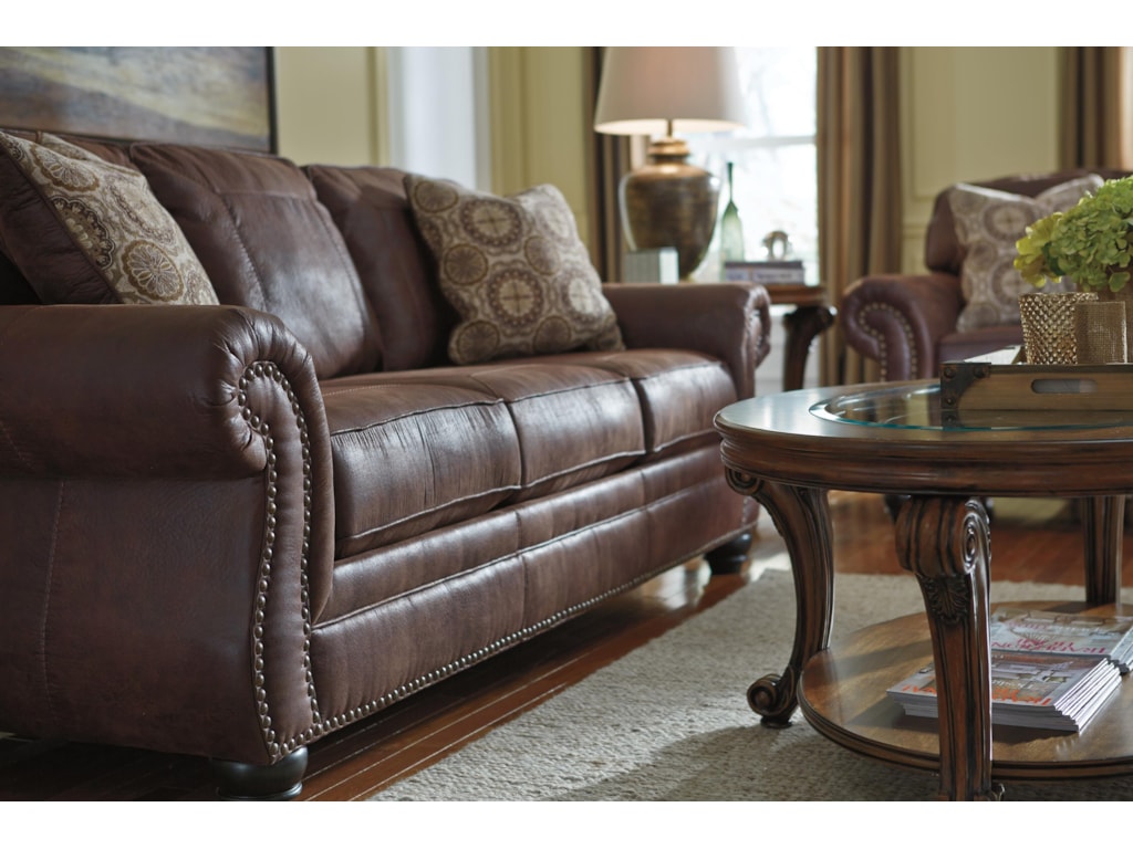 Breville Faux Leather Sofa With Rolled Arms And Nailhead Trim By Benchcraft At Household Furniture